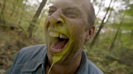 curtain-2015-001-gunk-spattered-man-laughing-in-wood